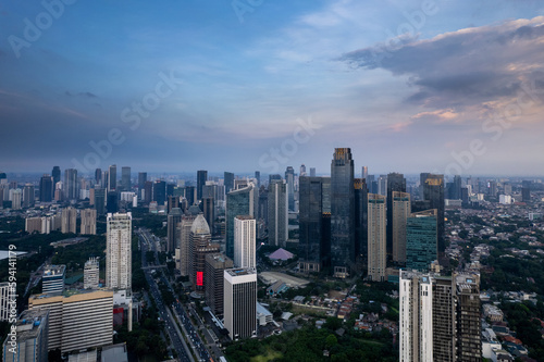 aerial shoot of Jakarta skyline during the golden hour. Jakarta is the capital city of indonesia that also one of the most populated city in the world. © alfin