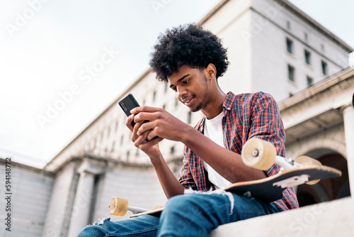 Skater Boy Using Phone