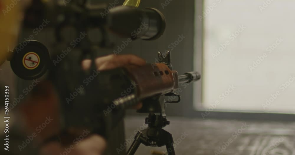 Sniper aiming FN FAL Combat Rifle and shooting in slow motion