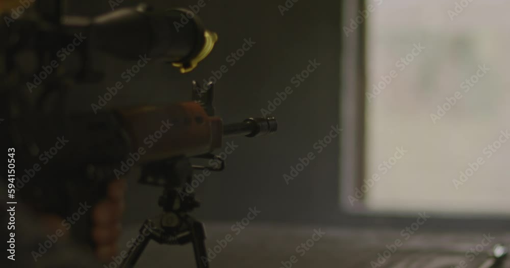 Close up of FN FAL combat rifle firing in slow motion