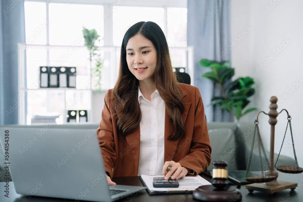 Lawyer or accounting department writes a note and uses a calculator to calculate expenses - income. at office lawyer. Lawyer or accounting department writes a note and uses a calculator to calculate expenses - income. at office lawyer.