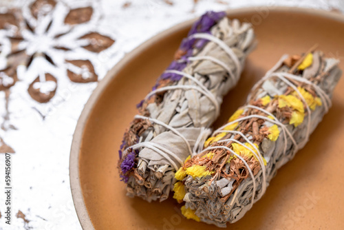 Sage smudge stiks on a plate