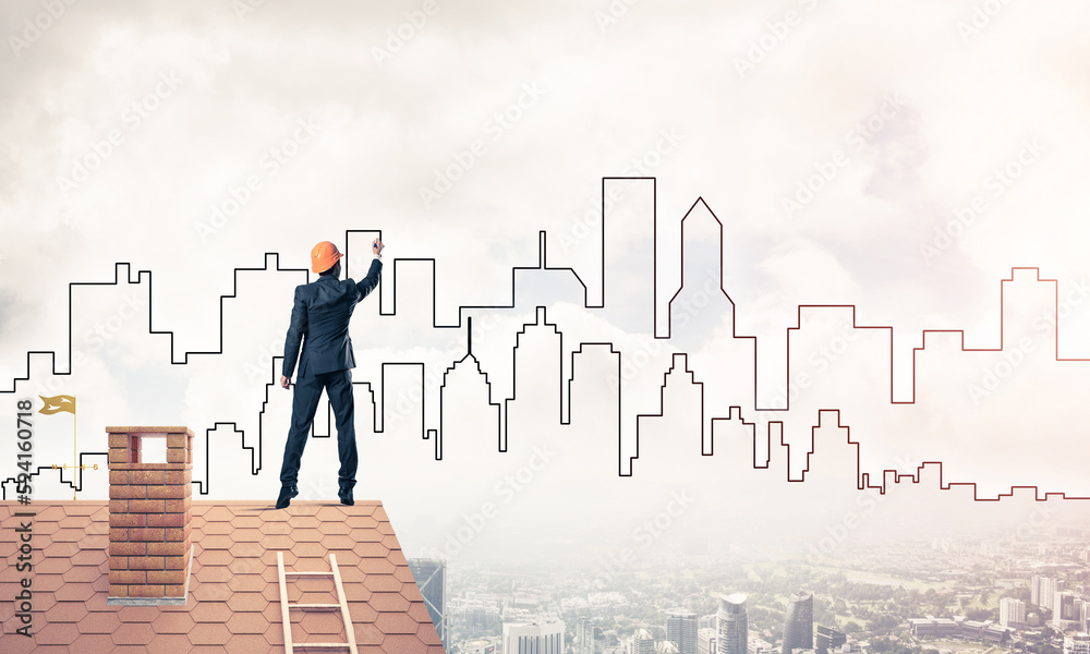 Man architect draw silhouette of modern city on blue sky. Mixed Man architect draw silhouette of modern city on blue sky. Mixed