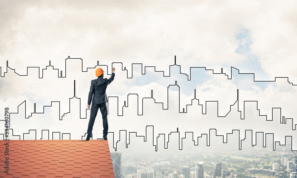 Man architect draw silhouette of modern city on blue sky. Mixed Man architect draw silhouette of modern city on blue sky. Mixed
