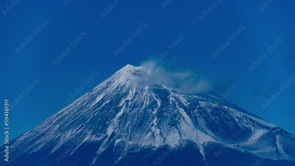 A timelapse of Mt.Fuji near Suruga coast in Shizuoka telephoto shot tilt A timelapse of Mt.Fuji near Suruga coast in Shizuoka telephoto shot tilt
