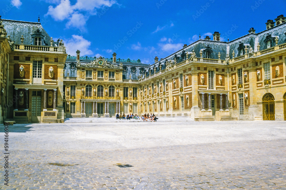 Palace of versailles with a group of people