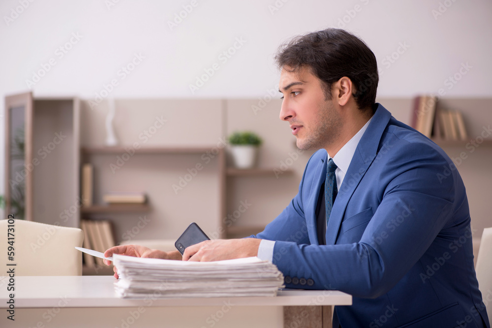 Young male employee working from home during pandemic