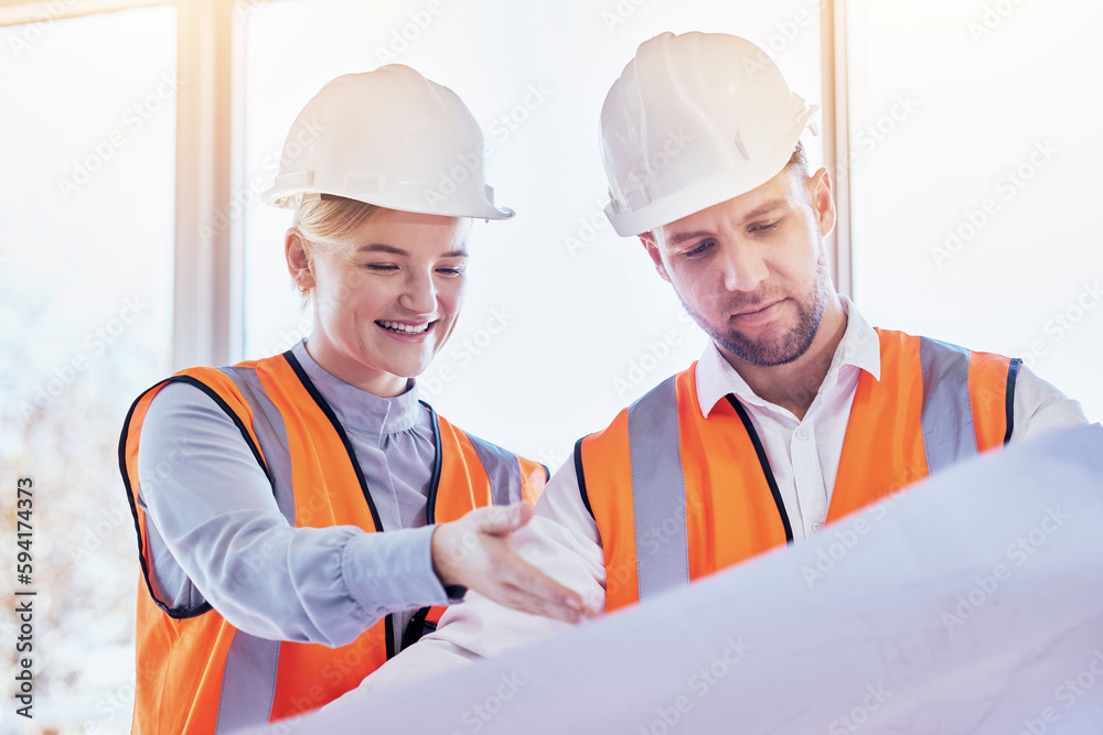 Architect, teamwork and planning with blueprint for construction, idea or site project at the office. Man and woman contractors in team strategy for building, floor plan or architecture at workplace Architect, teamwork and planning with blueprint for construction, idea or site project at the office. Man and woman contractors in team strategy for building, floor plan or architecture at workplace