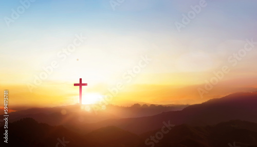 Fotografering Christian cross on hill outdoors at sunrise