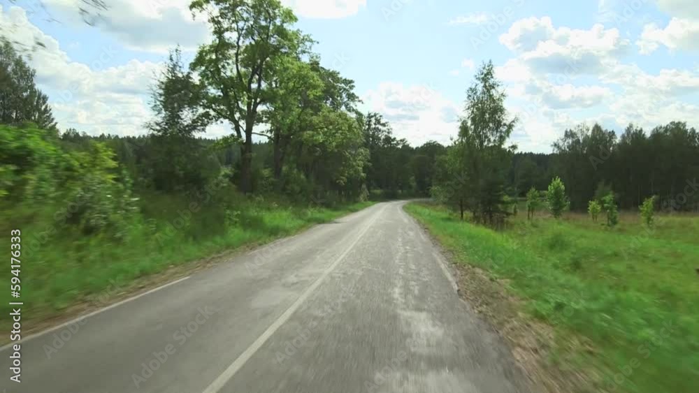 drive along a beautiful country road. steadicam shot of smooth driving through scenic countryside. drive along a beautiful country road. steadicam shot of smooth driving through scenic countryside.