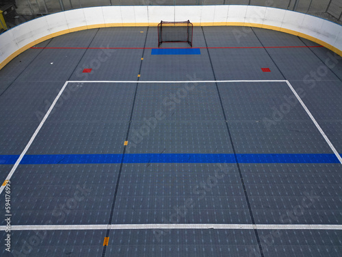 field hockey or ice hockey field. plastic grids of the dportovist surface under which there are hoses with cooling liquid. drone view of a modern ice rink. barriers and puck nets, aerial photo