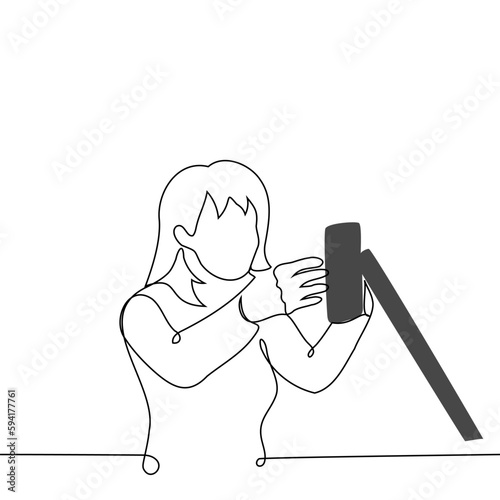 woman fixes mobile phone on tripod - one line drawing vector. concept female blogger or influencer before a live stream