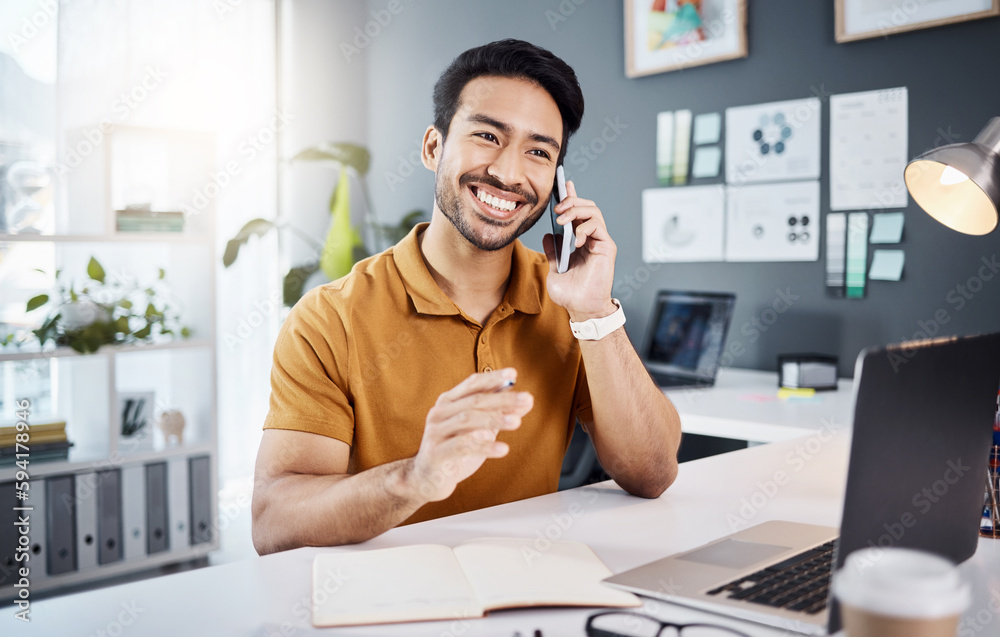 Phone call, smile and planning with a business man chatting while working at his desk in the office. Mobile, contact and communication with a young male employee chatting or networking for strategy