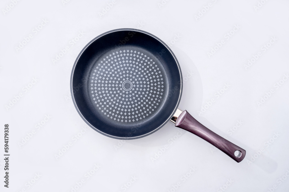 Top view of new empty frying pan isolated on white Top view of new empty frying pan isolated on white