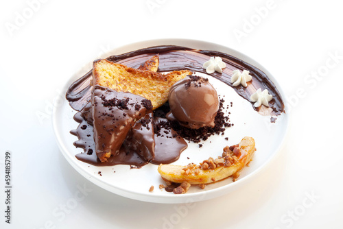 Chocolate french toast with a scoop of chocolate gelato ice cream on the side and banana sliced.