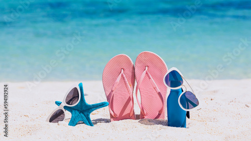Pink Flip flop in tropical summer a holiday and accessories on the beach background
