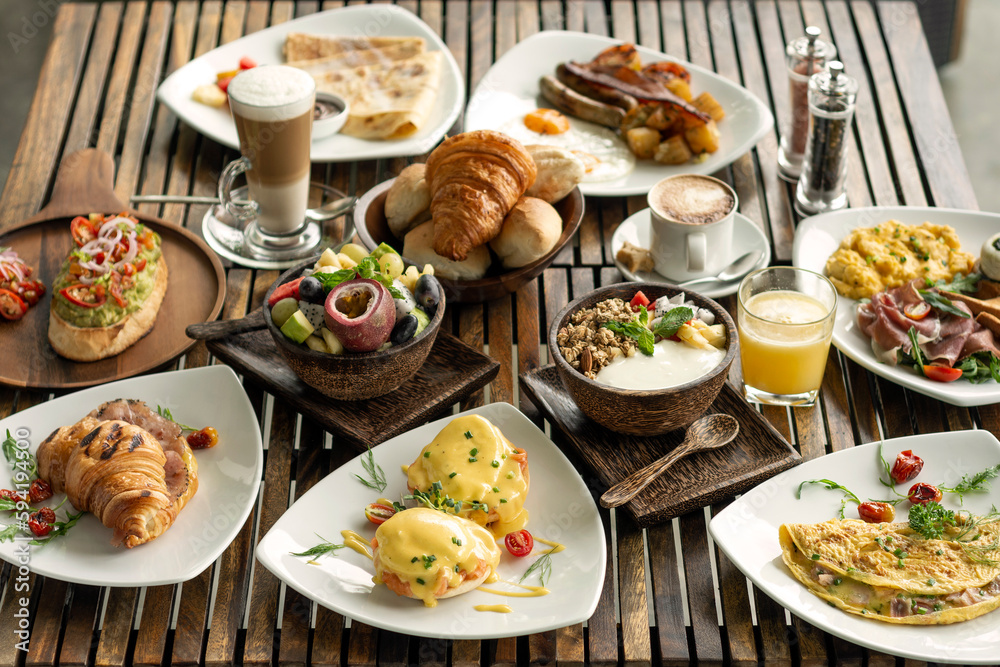 many mixed western breakfast food items on cafe table many mixed western breakfast food items on cafe table