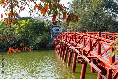 The Huc Bridge (Welcoming Morning Sunlight Bridge) is a footbridge over Hoan Kiem Lake. Hanoi, Vietnam photo