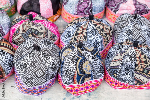 Hmong males' traditional headwear is sold at a street market