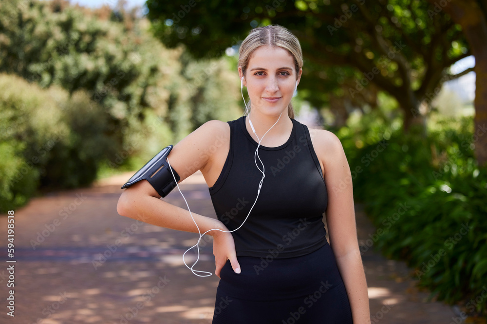 Headphones, runner or portrait of woman in park training, exercise or workout for a healthy body. Wellness, fitness break or sports girl athlete exercising or streaming audio or radio song in nature Headphones, runner or portrait of woman in park training, exercise or workout for a healthy body. Wellness, fitness break or sports girl athlete exercising or streaming audio or radio song in nature