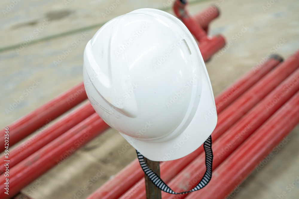 White plastic hard hats for safety equipment and Occupational Health