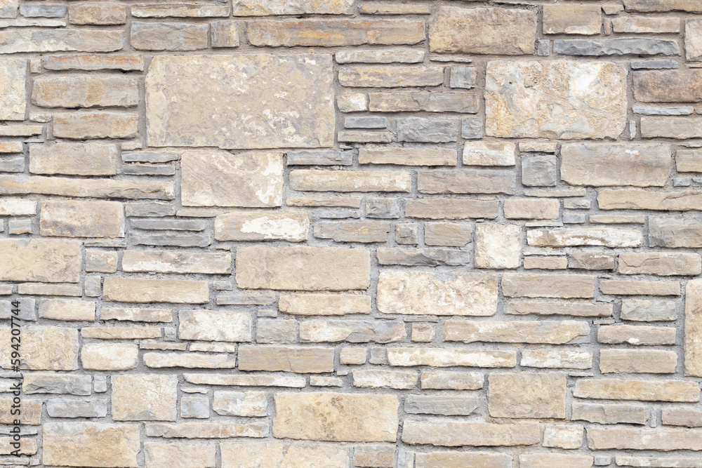 Solid gray and beige stone wall, good for background Solid gray and beige stone wall, good for background