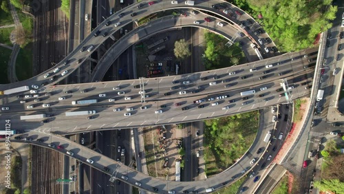 Mesmerizing aerial of highway patterns and ramps with slow moving traffic. 4K overhead aerial. photo