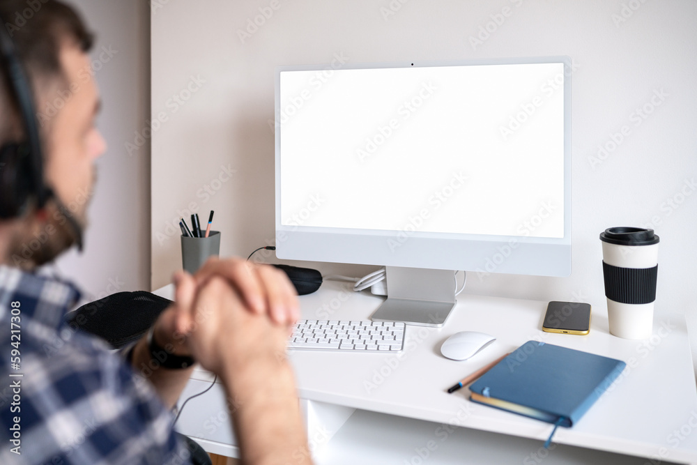 Blank screen computer monitor, man sitting at desk and looking at screen. Blank screen computer monitor, man sitting at desk and looking at screen.