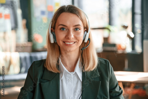 Portrait of young beautiful woman in formal clothes that is working in the office