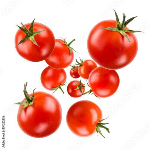 Small red cherry tomatoes floating on white background.