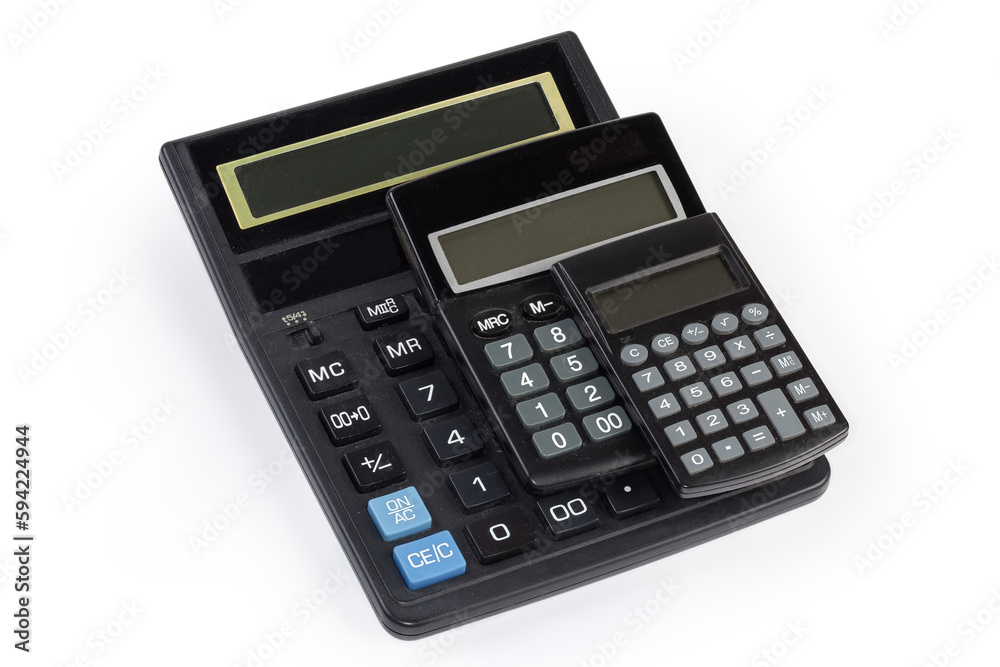 Different used electronic calculators stacked on a white background Different used electronic calculators stacked on a white background