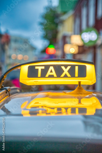 Yellow Taxi sign over a car in Reykjavik, Iceland