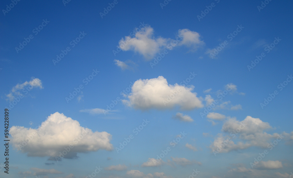 white fluffy clouds in the blue sky