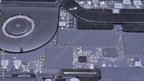 Dusty interior of a laptop. Close-up panning footage.