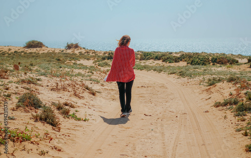 Beautiful young woman in the desert, Tamri Agadir, Morocco 