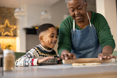 Grandmother and Grandson baking at Christmas together photo