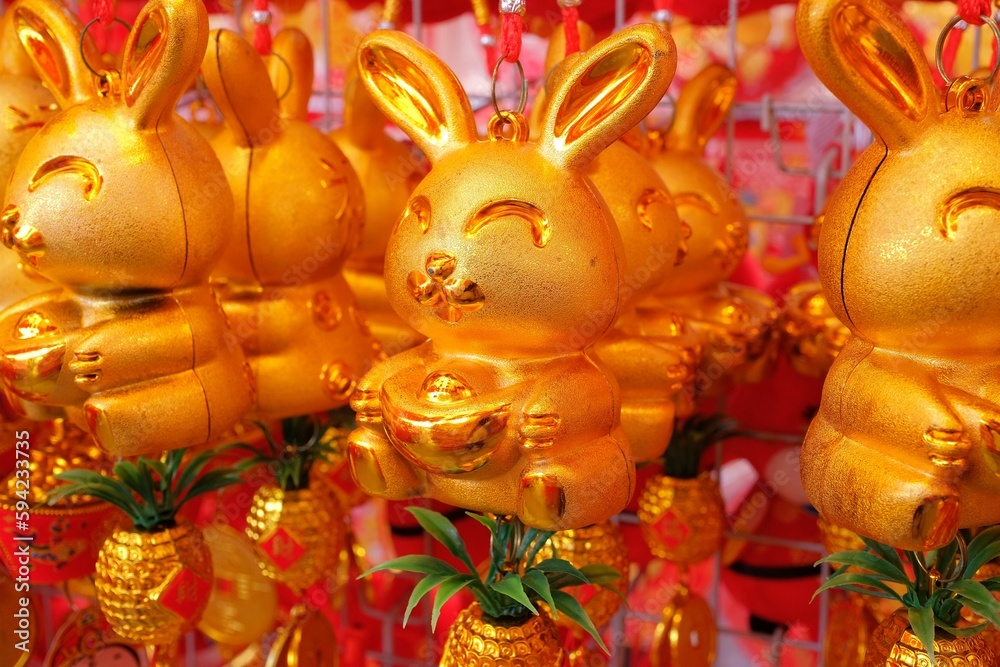 Golden rabbit trinkets and ornaments, for sale at a bazaar, Chinese New Year of the Rabbit