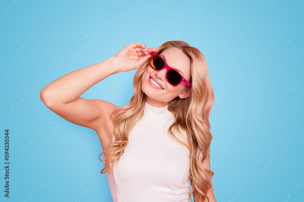 Portrait of lovely positive stylish girlfriend with beaming smile, fashionable successful confident chick in summer glasses holding eyelet with hand isolated on pink background Portrait of lovely positive stylish girlfriend with beaming smile, fashionable successful confident chick in summer glasses holding eyelet with hand isolated on pink background