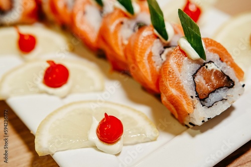 A closeup shot of sushi rolls on a white plate