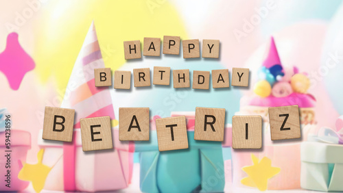 Happy Birthday Beatriz card with wooden tiles text. Girls birthday card with colorful background. photo