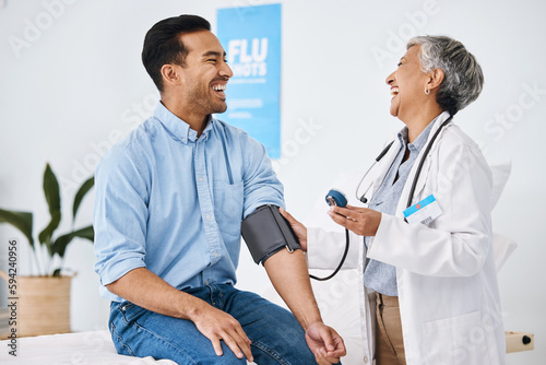 Photography Doctor, patient and blood pressure consultation in hospital while laughing and talking about health