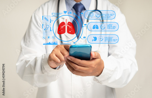 A physician in uniform reads a lung examination report on a smartphone's virtual display while standing in a hospital