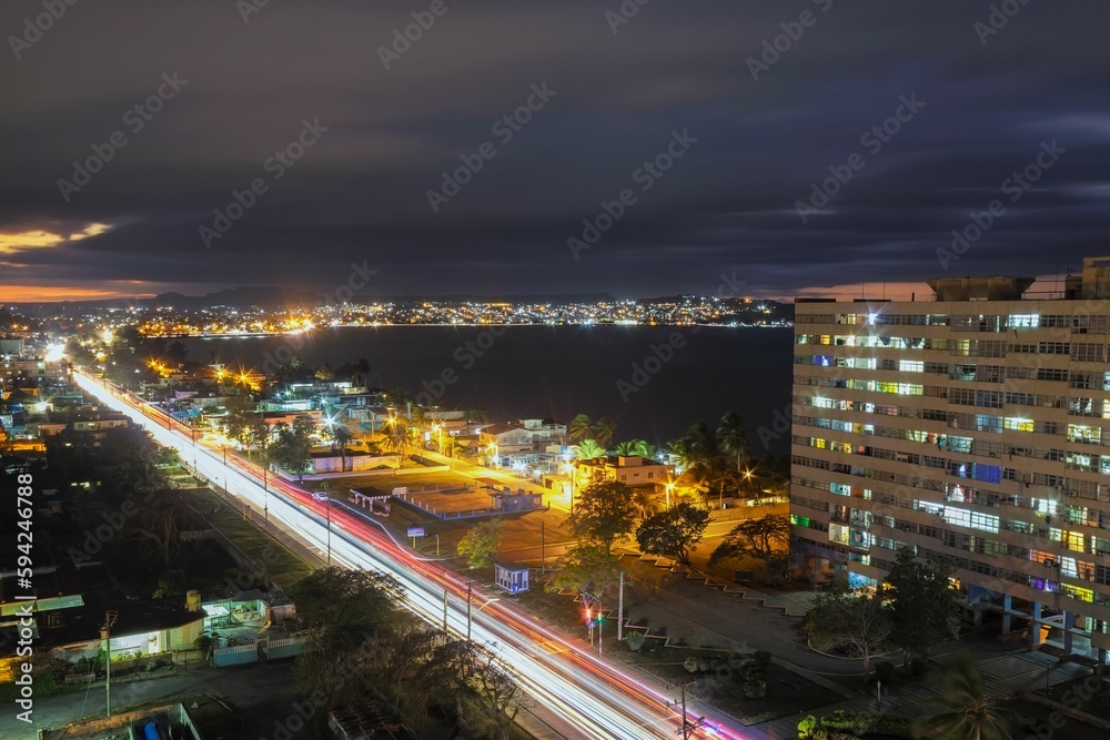 Long exposure shot of the traffic light of the illuminated Matanzas in Cuba at night