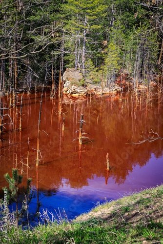 Red lake next to closed copper mine, Elshitsa, Panagyurishte, Bulgaria