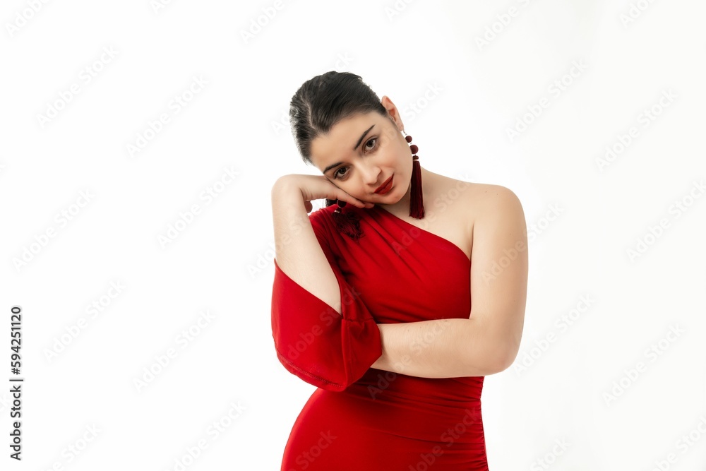 Peaceful beautiful female in red dress posing on white background Peaceful beautiful female in red dress posing on white background