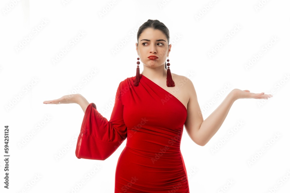 Confused attractive female in red dress posing on white background Confused attractive female in red dress posing on white background