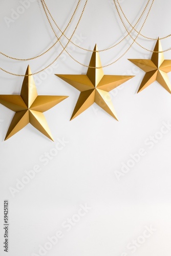 Obraz na plátně Background of white with Christmas ornaments in the form of golden stars, provid