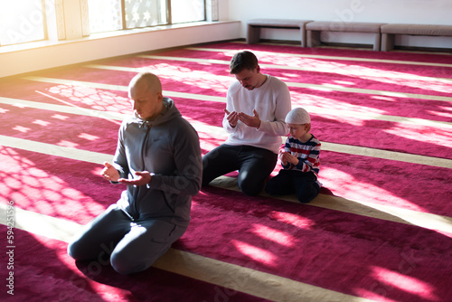 Islamic, community or people in praying with boy or kid for Gods support, spiritual peace during ramadan