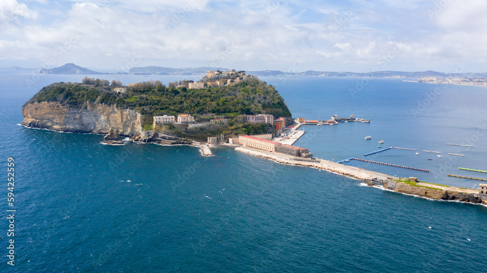 Aerial view of the island of Nisida. It is located in Naples, Italy. Nisida is a volcanic islet of the Flegrean Islands archipelago. It is connected to the mainland by a long pier.