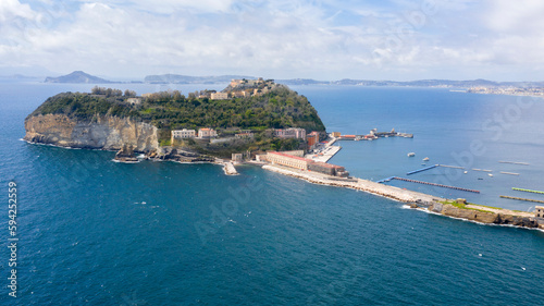 Aerial view of the island of Nisida. It is located in Naples, Italy. Nisida is a volcanic islet of the Flegrean Islands archipelago. It is connected to the mainland by a long pier.